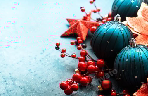 Preview: Blue Christmas or New Year background with blue Christmas balls, red berries and stars, top view