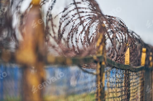 Preview: Barbed wire on fence of restricted area