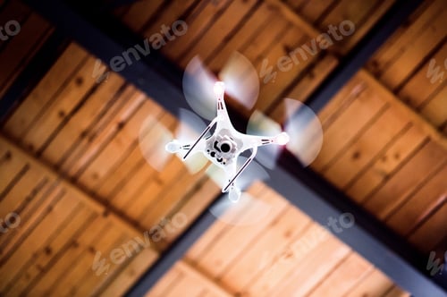 Preview: White drone flying inside the building.
