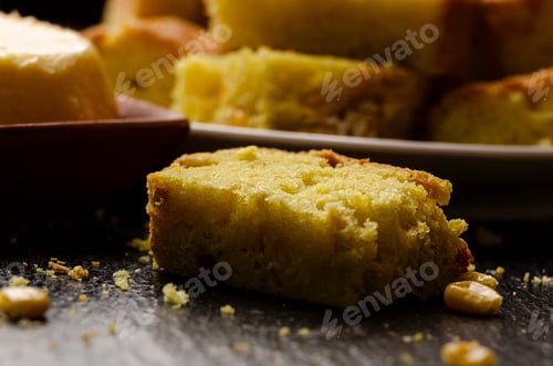 Preview: Slices of homemade cornbread and butter on kitchen table