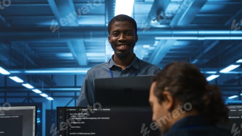 Preview: Jolly supervisor oversees technicians in data center mending supercomputers