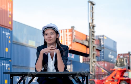 Preview: Portrait of engineer worker of factory technician with Chinese woman style sit in cargo area