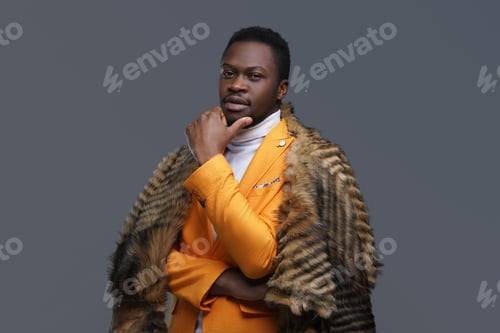 Preview: Black trendy guy in orange coat with fur