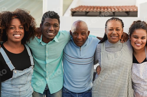 Preview: Happy african family smiling on camera at house patio