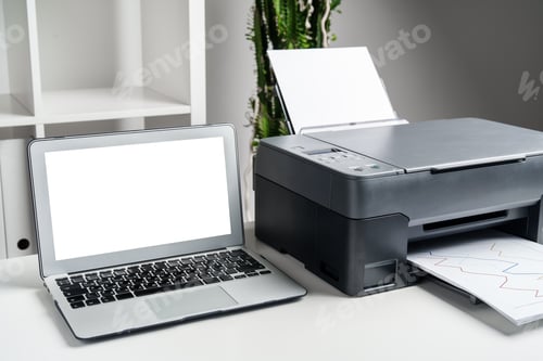 Preview: New modern printer and laptop in the office on table