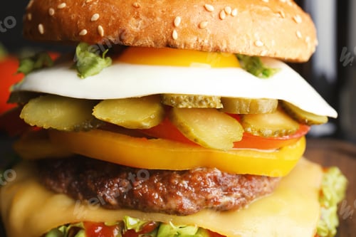 Preview: Closeup view of tasty burger with fried egg