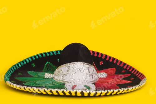 Preview: Tricolor mariachi hat on yellow background. Cinco de mayo festive background.