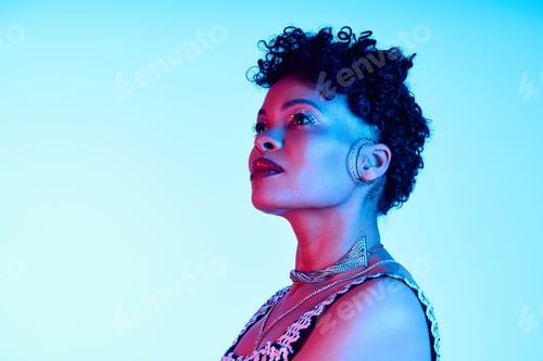 Preview: Elegant modern woman showcasing trendy fashion in vibrant blue and pink lighting