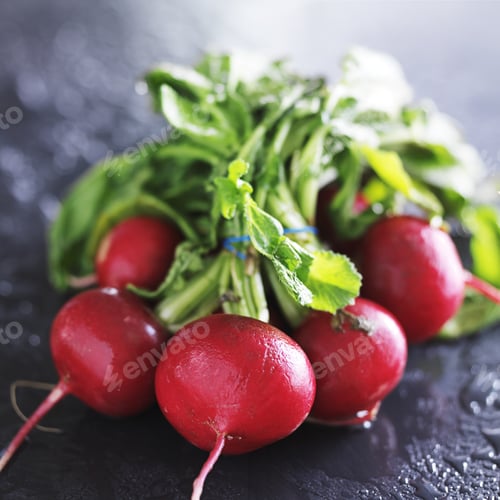 Preview: bunch of fresh radishes on slate surface
