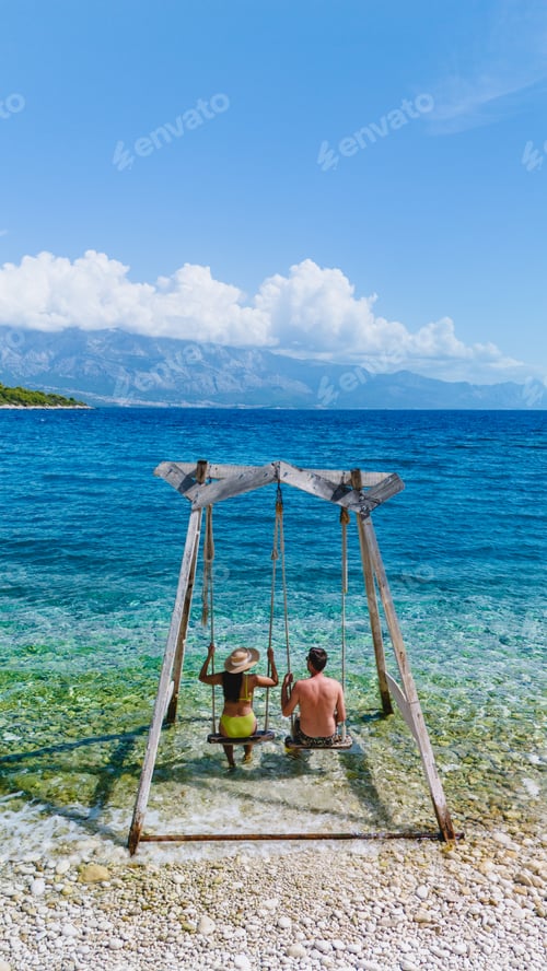 Preview: Relaxing swing by the crystal-clear waters of Brac Island in Croatia on a sunny day