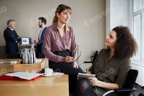 Preview: Colleagues in office chatting