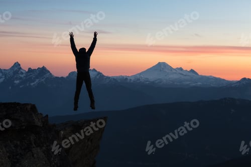 Preview: Adventurous man on top of the mountain