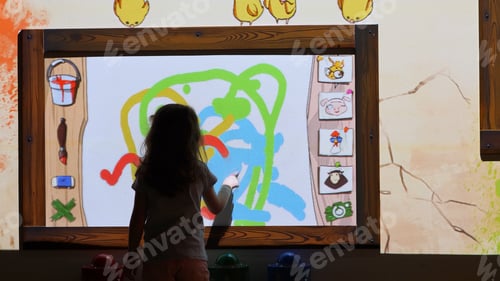 Preview: Little girl uses multimedia whiteboard to express her creativity.