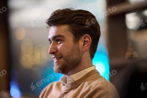 Preview: A close-up image captures a stylish man patiently waiting for his iftar meal during Ramadan, exuding
