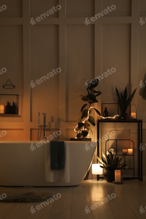 Preview: Stylish bathroom interior with houseplants and string lights. Home design