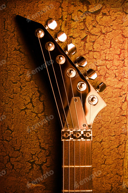 Preview: top of guitar over grunge background