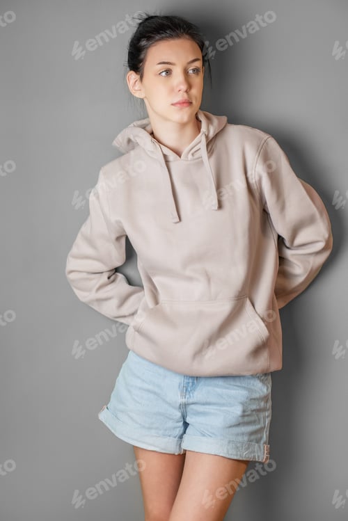 Preview: Pensive thoughtful young girl wearing sweatshirt with hood
