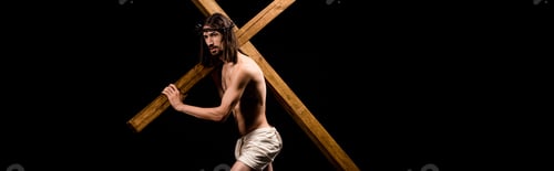 Preview: panoramic shot of shirtless jesus in wreath holding wooden cross and standing isolated on black