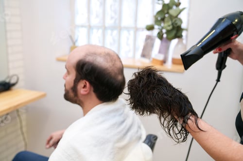 Preview: Hair Specialist Dries Natural Hair Prosthesis for Client