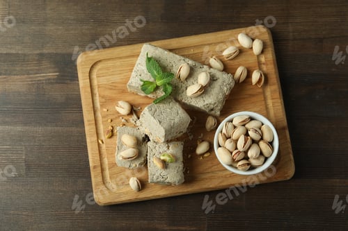 Preview: Concept of tasty food with halva on wooden background