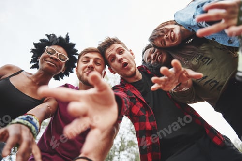 Preview: Trying to reach you. Multi ethnic group of people have party outdoors. View from down