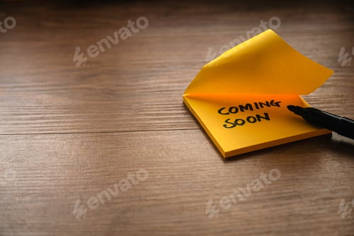 Preview: Coming soon written on a yellow paper with a black marker pen.