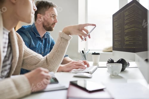 Preview: Busy guys brainstorming about computer language