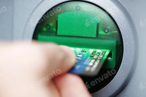 Preview: Man pushing credit card at cash dispenser, close-up