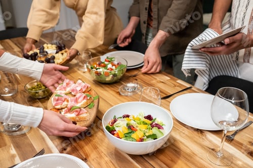 Preview: People preparing for dinner party