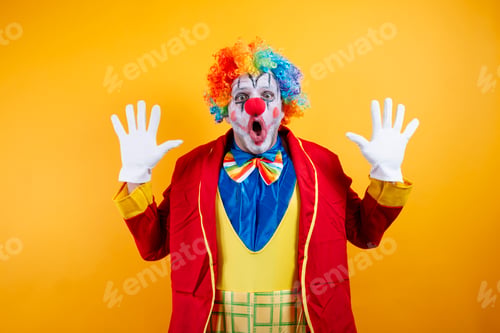 Preview: Shocked clown with rainbow wig, wide-eyed, hands up
