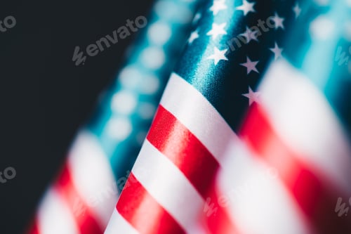 Preview: selective focus of united states of america national flags isolated on black, memorial day concept