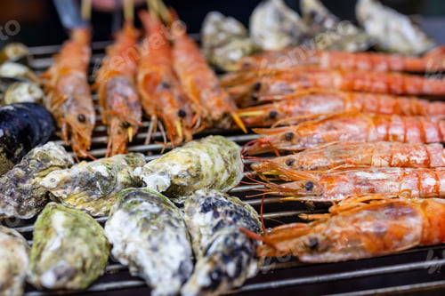 Preview: Mixed seafood barbecue on grill metal net