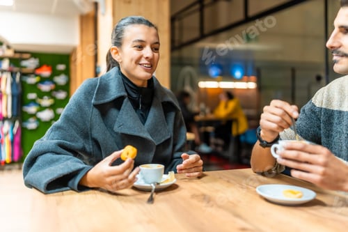 Preview: Friends enjoying coffee and conversation at a sports cafe