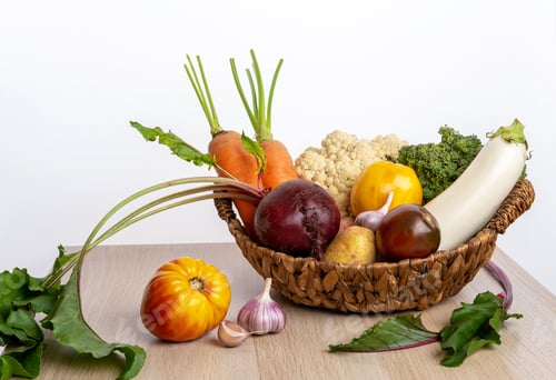 Preview: Freshly bunch harvest. Fresh farm vegetables in wicker basket.