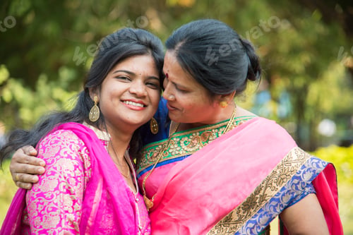Preview: Portrait of happy mother and daughter embracing.