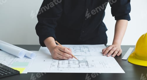Preview: Architects or engineers working construction and drawing construction plans, printing, writing