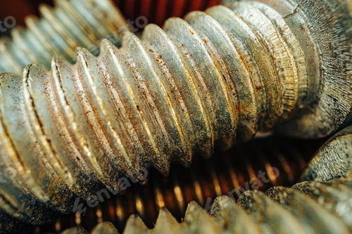 Preview: Many metal screws on concrete close up