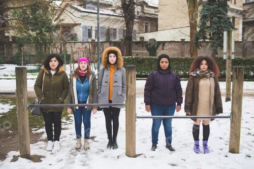 Preview: group of young multiracial women standing in play area outdoor