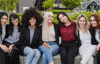 Preview: Smiling Women Gathered Together Wearing Business Attire