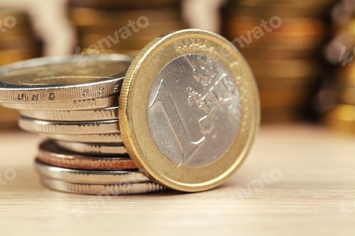 Preview: piles of coins on working table