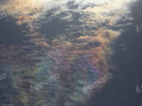 Preview: Iridescent Clouds - Photograph Of Clouds In A Blue Sky With Iridescent Colors On The Clouds.