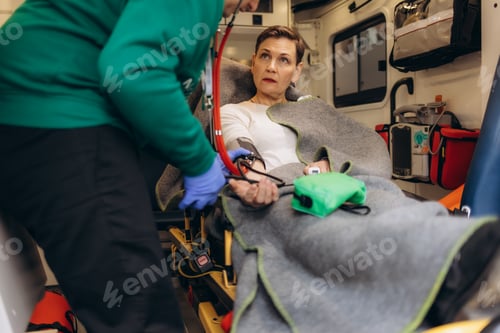 Preview: A woman's blood pressure is measured in an ambulance