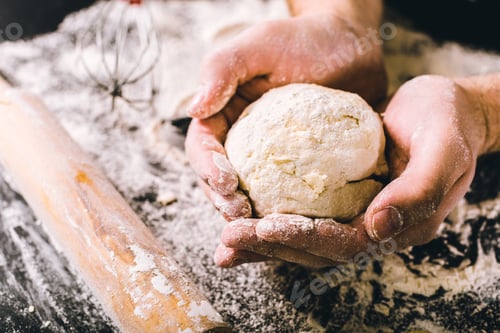 Preview: Hands kneading a dough
