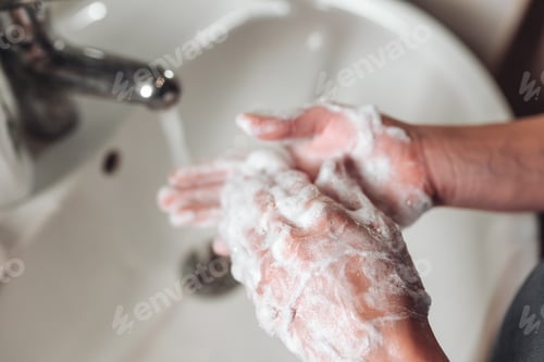 Preview: Man washing hands to protect against the coronavirus