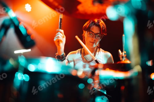 Preview: Drummer playing drums during live rock concert music festival