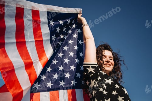 Preview: Girl with an American flag. Independence Day concept