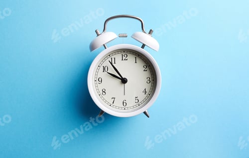 Preview: White vintage alarm clock on empty blue color background