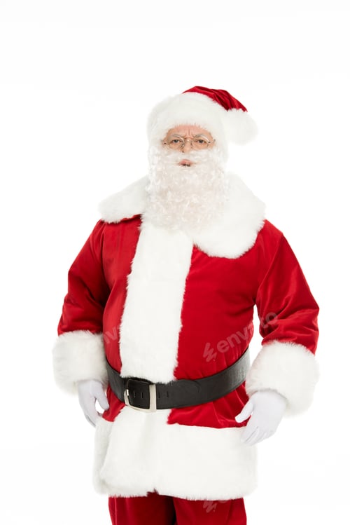Preview: Three quarter length view of Santa Claus posing and gesturing isolated on white