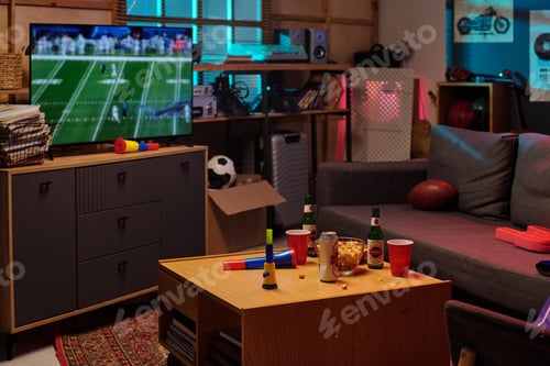 Preview: Living Room Showing Unrecognizable People Watching Football Game on Television