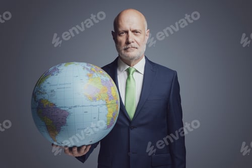 Preview: Corporate businessman holding a globe